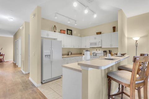 Fully equipped kitchen and bar chairs