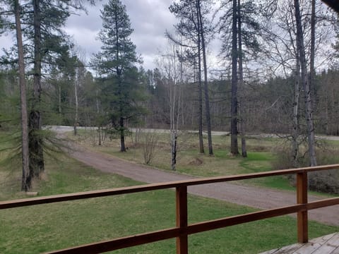 view off front deck towards highway. Elk farm across road, often visible!