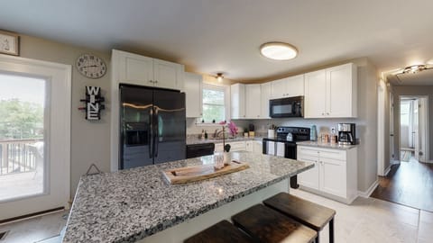 Kitchen with an island that can seat four.