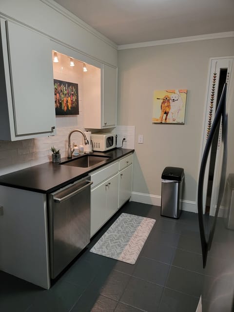 Galley Kitchen- gas range/oven, large capacity refrigerator, dishwasher, granite