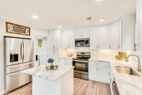 Bright kitchen is stocked with everything you will need after a day on the lake.