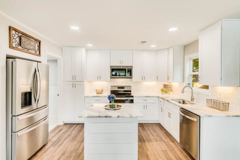 Laundry room is located off corner of kitchen.