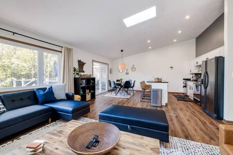 Main Level Living Room with Lake Views, Huge Smart TV, and Electric Fireplace! Cozy up on the couch for a movie or have a game night with provided games.

(Left Side of Duplex)

[Living room 1 of 4 for whole duplex]