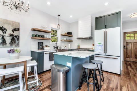 well equipped kitchen with gas range and dining