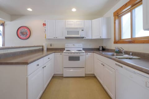 Cook, dine, and unwind in this fully equipped, modern kitchen designed for both convenience and style.