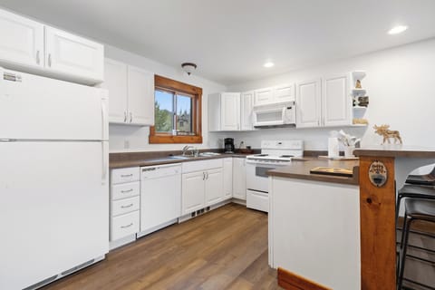 Cook, dine, and unwind in this fully equipped, modern kitchen designed for both convenience and style.