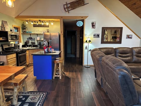 Cozy cabin retreat with open design, rustic decor, full kitchen & mountain charm