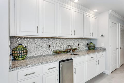 Wet bar with wine/liquor specific glassware. 