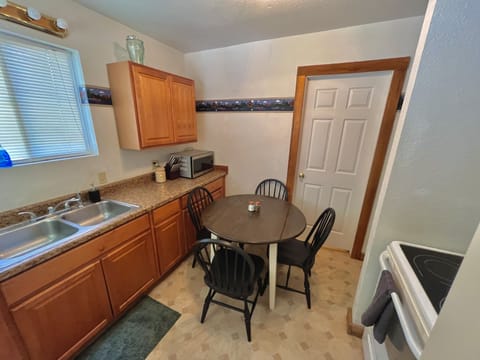 There are two more bar stools under the stairs to go up from the main floor.
