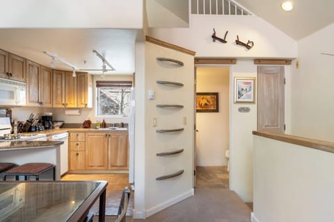 Wall-mounted steps to the loft.
