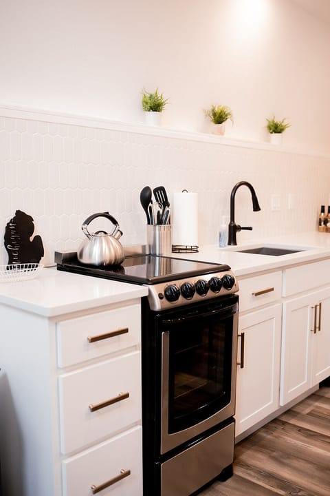 Kitchen includes an oven and stove