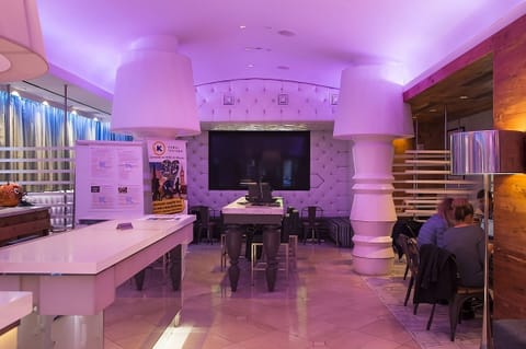 Gather in the vibrant lobby lounge with playful designer lighting.