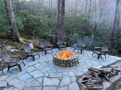 Gather around the outside firepit for cozy warmth and the enchanting ambiance of a winter escape.