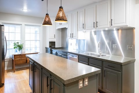 The kitchen is just off the living area and completely updated with commercial stainless appliances.