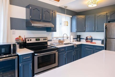 Fully equipped kitchen with stainless appliances.
