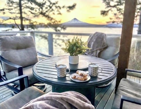 Driftwood Dreams on the main deck - water views in every direction & Mt. Baker showing off. Our guest reviews inform us that this is where their days begin and end.  Come experience it for yourself.