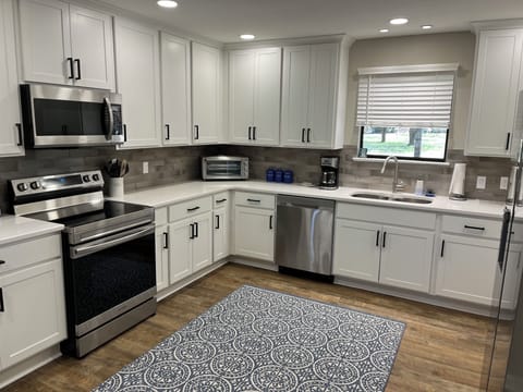 Very large open kitchen fully stocked. All SS new appliances, double sink