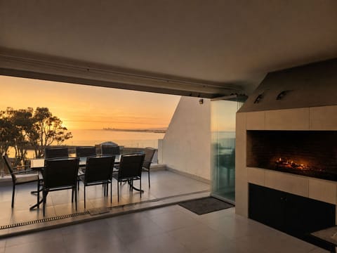 Braai area with view of the harbour and a outdoor seating area