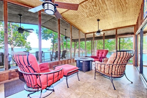 Screened deck with firepit.