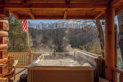 Hot tub on the front deck overlooking the lake where will enjoy quite evenings