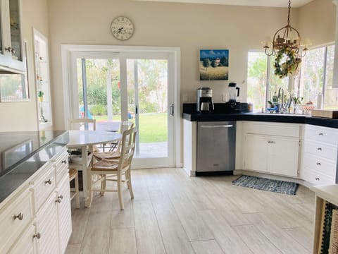 Kitchen with gas range, microwave, dishwasher and full size refrigerator. 