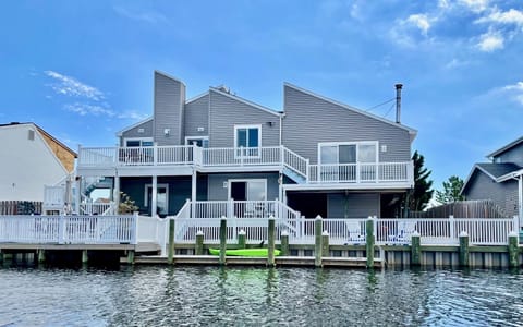 Outdoor fun in a fully fenced backyard, 72 ft waterfront & three-level deck.