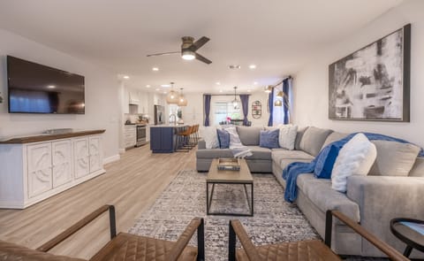 Open Great Room, Large TV, Comfy Sectional.