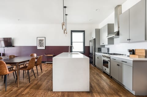 Large kitchens with modern appliances in both units.