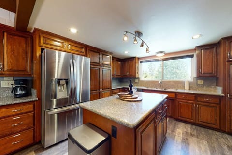Gourmet kitchen with center island and large fridge for all your goodies