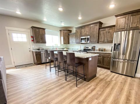 Chef’s dream kitchen with granite island seating—perfect for meals, conversation, and entertaining.