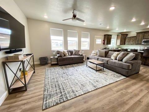 Open-concept living area with cozy seating and natural light—perfect for gathering and relaxing.