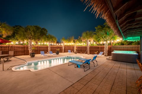 Our private backyard pool and hot tub at night!