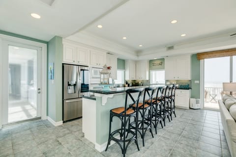 Grab a snack or serve food on the large breakfast bar