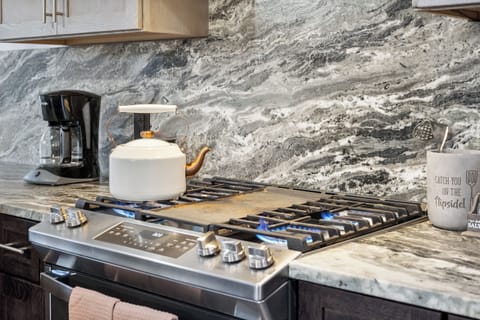 Fully equipped kitchen with gas range. 