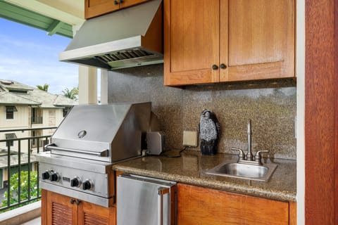 Rare lanai setup with built-in grill and outdoor refrigerator