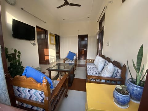 Living room with AC and TV