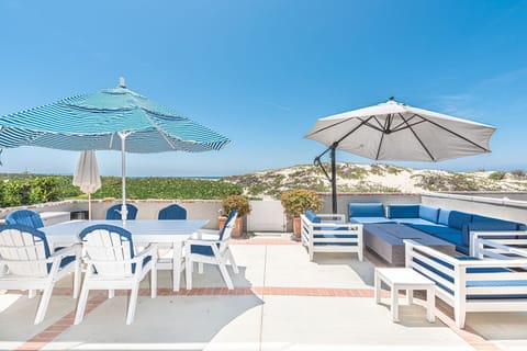 You'll want for nothing in this bright and cheery beachfront home located on the most idyllic stretch of sand in Newport.
                