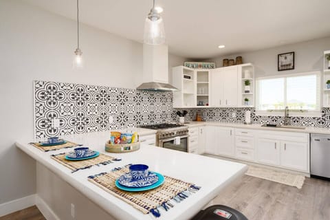 Bright and beachy kitchen — fully stocked for cooking up seaside feasts and morning coffee moments.
