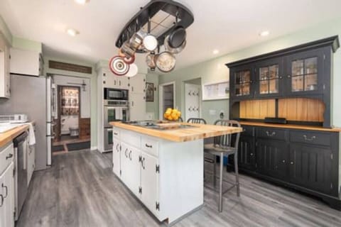Gather around our kitchen island with seats, the perfect centerpiece where family and friends can come together, share stories, and create lasting memories.