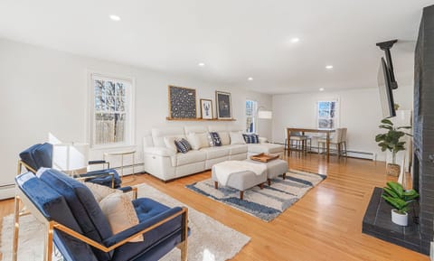 Spacious living room with large screen flat TV.