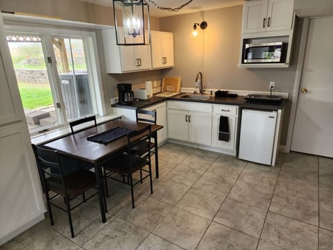 Kitchen/dining room. The table easily slides out when eating.