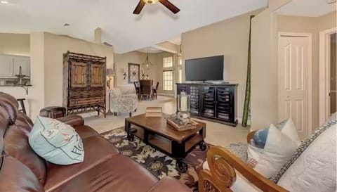 Family room with reclining sofa, comfy chairs and smart tv with streaming. 