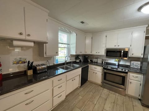 Kitchen has pots and pans to cook meals