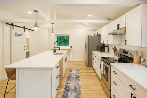 A bright, modern kitchen fully stocked for your stay