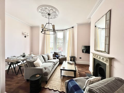 Living Room with Smart TV and Dining Table (1)