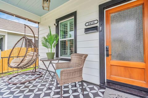 Front porch is picture perfect spot for relaxing and listening to the seabreeze.