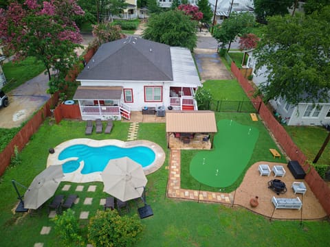 Updated photo of backyard with putting green and firepit added June 2026