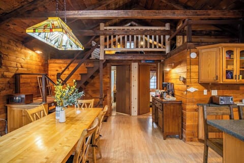 Open concept living keeps the whole group close whether cooking, eating, making a warm drink at the coffee bar or hanging out in the open loft 