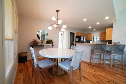 Gather around the dining table for food, conversation, or fun.