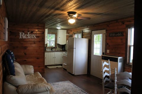 Living room, dining room, kitchen - direct lake views from all windows.
